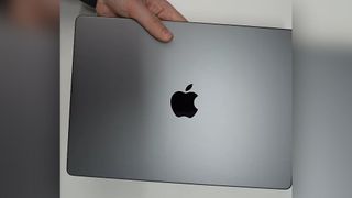 A leaked pre-release M4 MacBook Pro held by YouTuber Romancev768