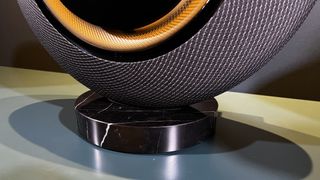 Marantz Horizon speaker in black showing its marble stand