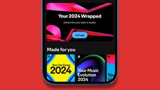 A phone on a red background showing a Spotify Wrapped 2024 banner