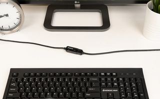 IOGear USB 2.0 Booster Extension Cable in front of a keyboard