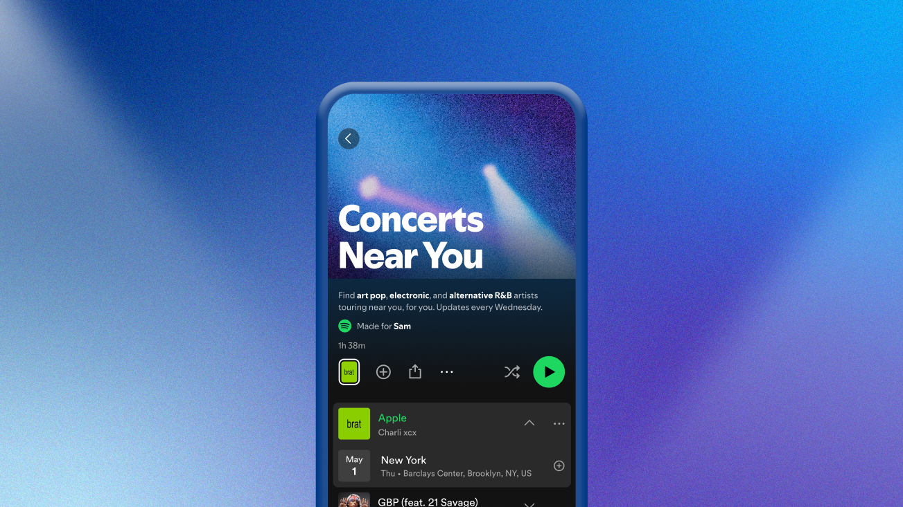 A photograph of a phone displaying Spotify's Concerts Near You page