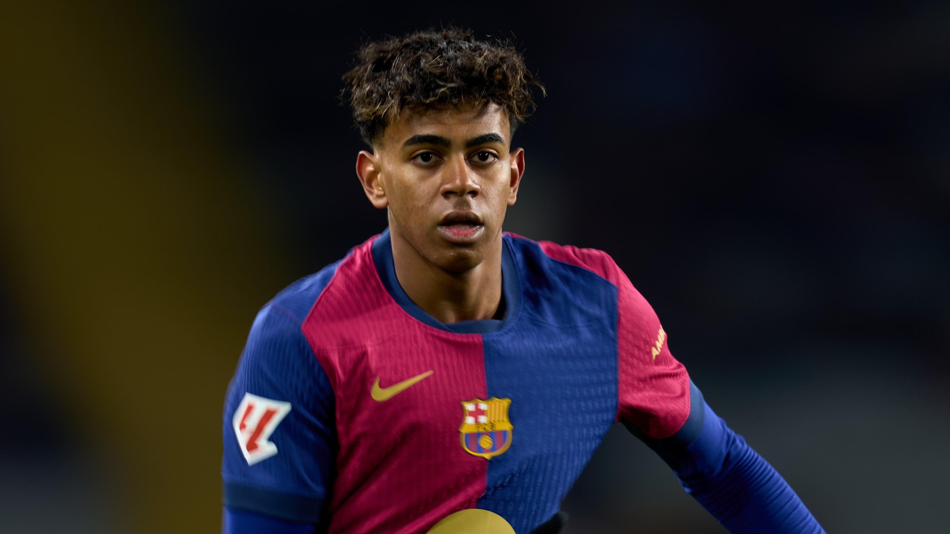 Lamine Yamal of FC Barcelona runs the pitch ahead of his likely appearance in the