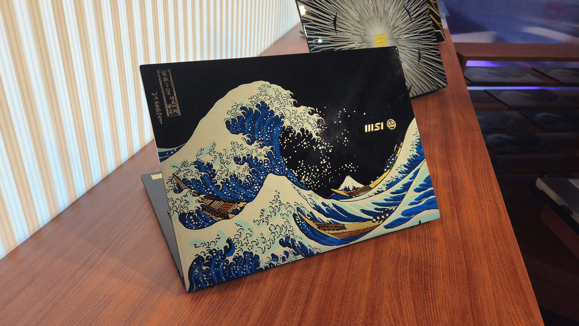 The MSI Prestige 13+ AI Ukiyo-e Edition laptop on display at Computex 2025