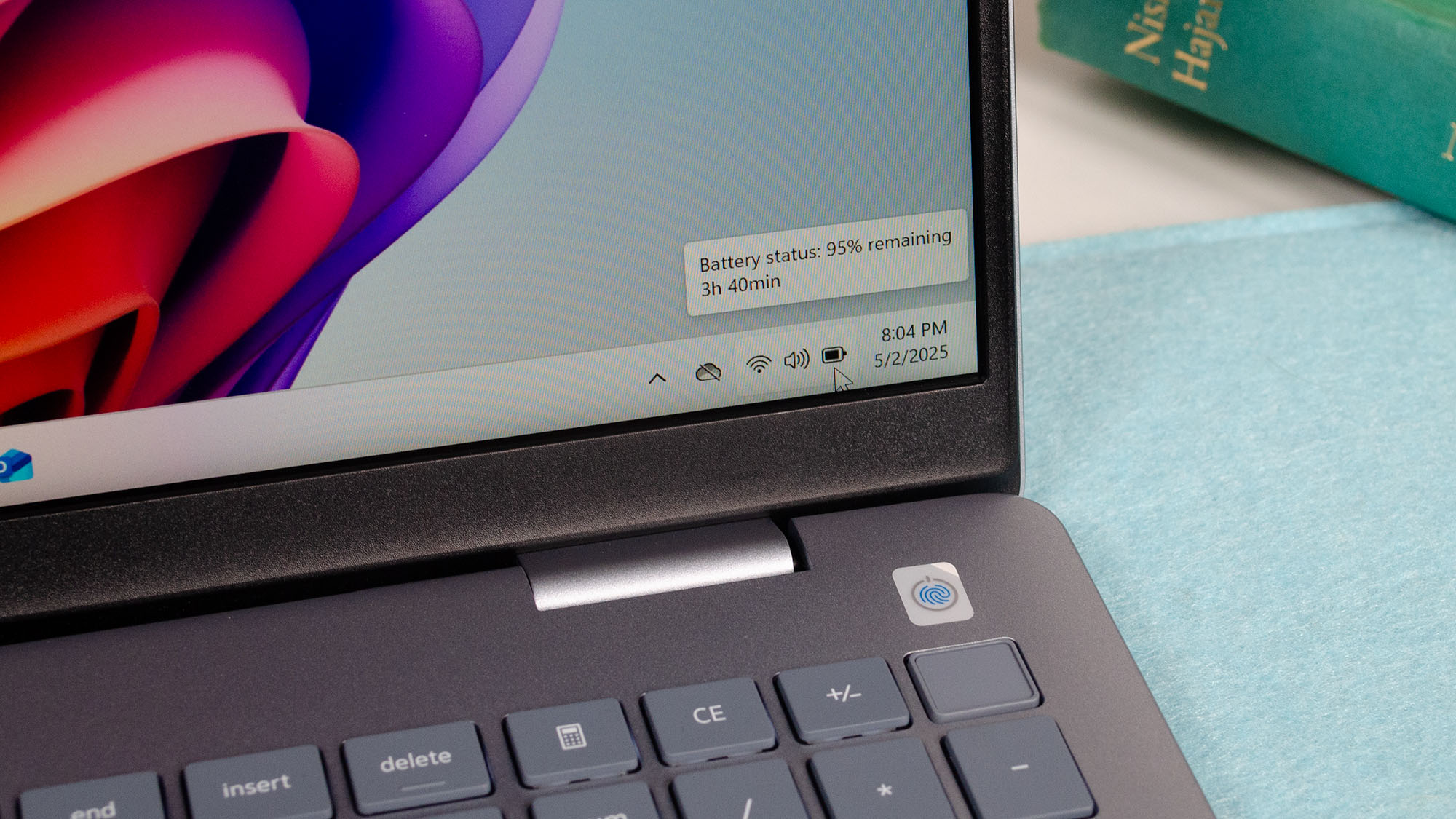 The Windows 11 desktop showing a close up of the taskbar system tray