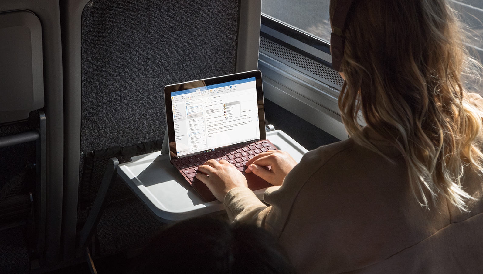 Person using a Windows 10 Surface 2-in-1 laptop