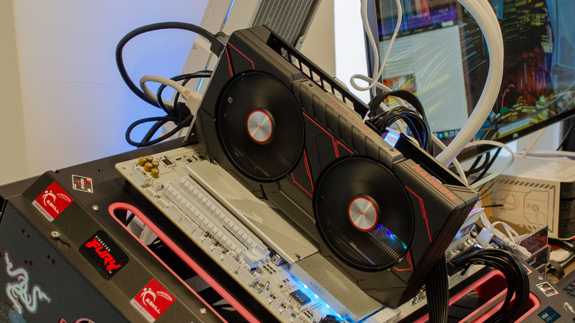 An AMD Radeon RX 9060 XT slotted into a testbench