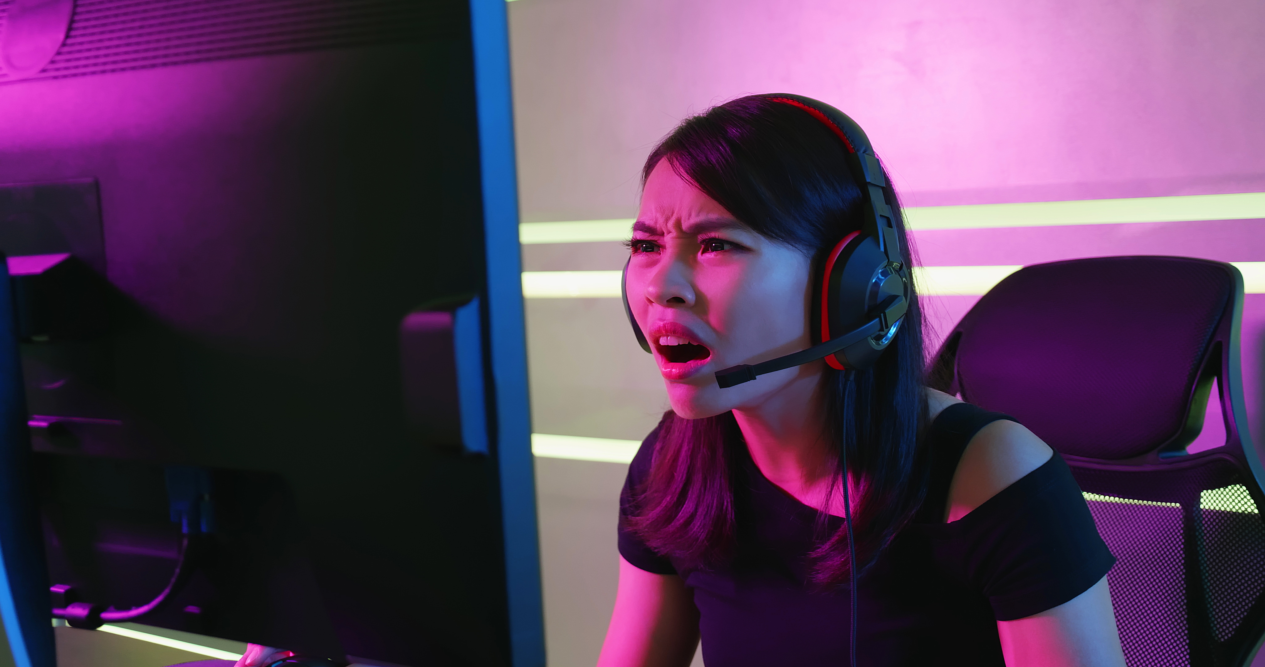 PC gamer looking at retail website on monitor in anger and disbelief at price of RAM