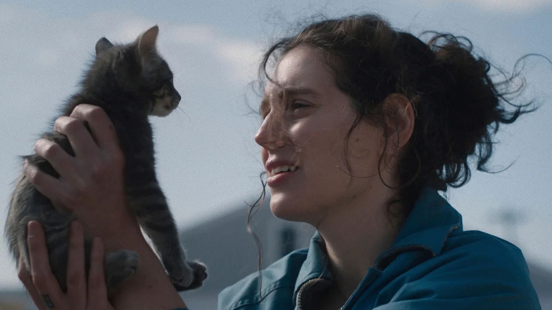 Eva Victor holds a cat