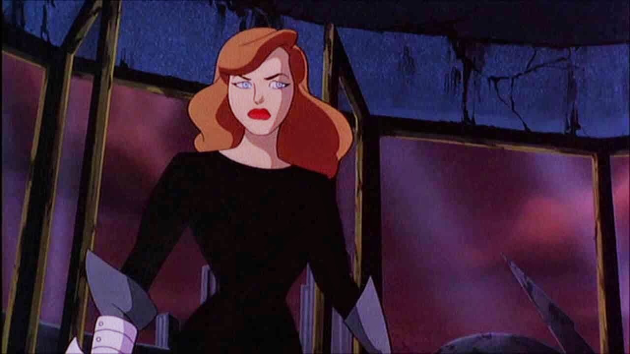 Andrea Beaumont standing with an annoyed look on her face in Batman: Mask of the Phantasm