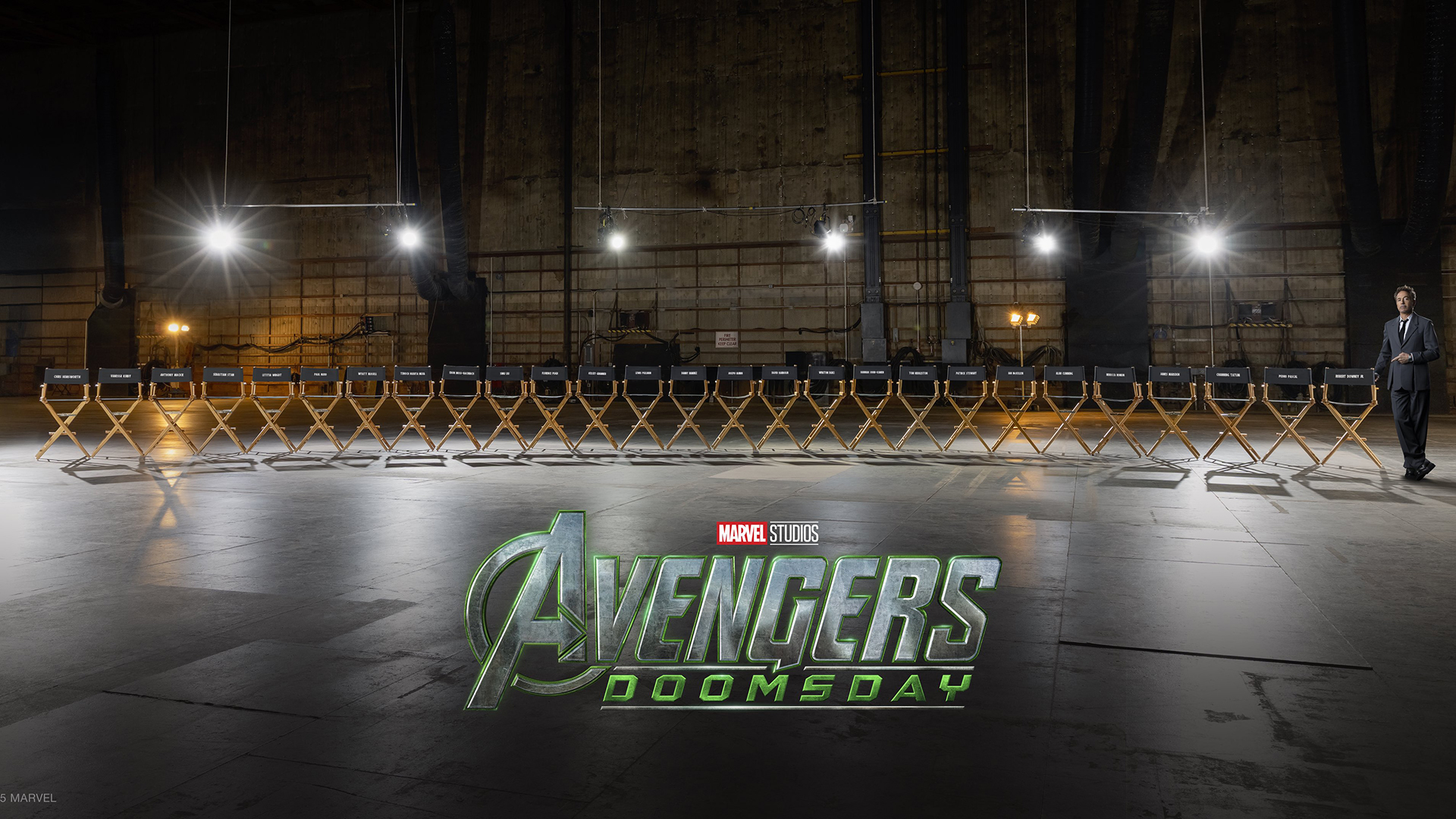 The Avengers: Doomsday logo imposed on an image of 27 actor chairs with Robert Downey Jr standing off to the right side