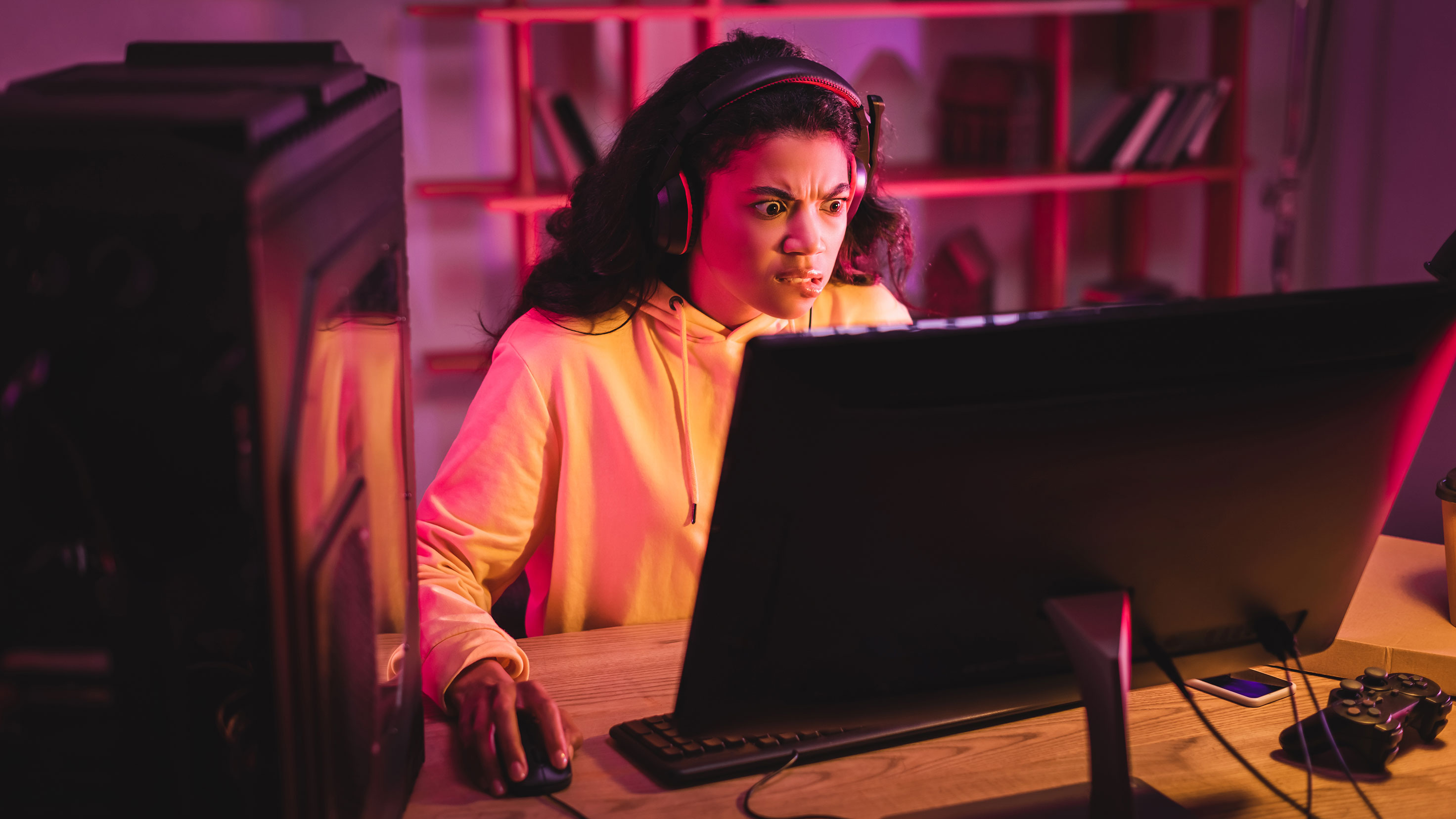 PC gamer looking confused at monitor