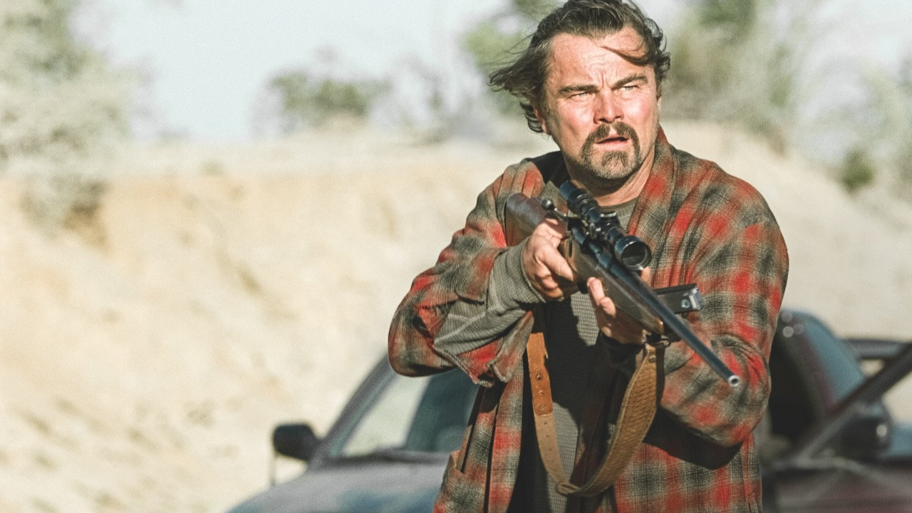 Leonardo DiCaprio's Bob wielding a rifle in One Battle After Another
