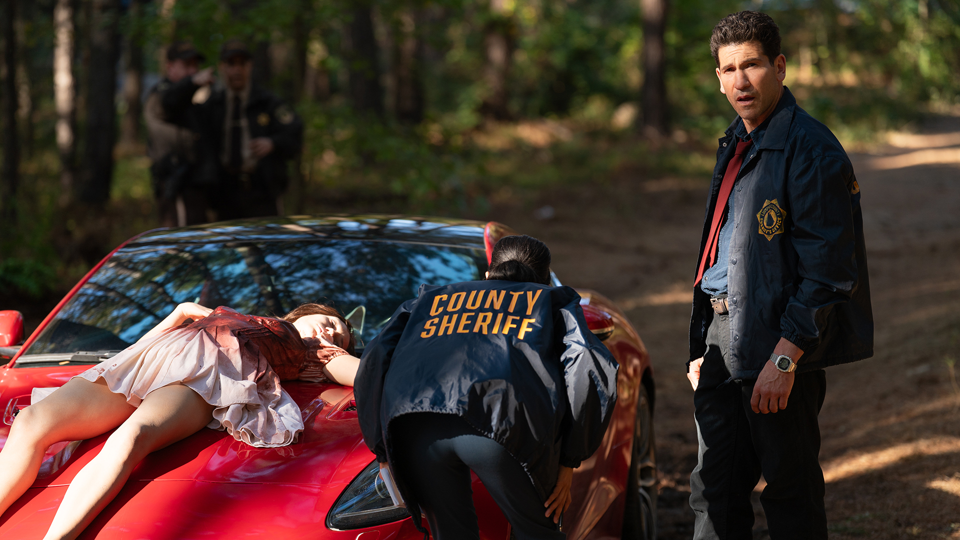 Detective Harper and another officer inspecting a crime scene in His &amp;amp; Hers