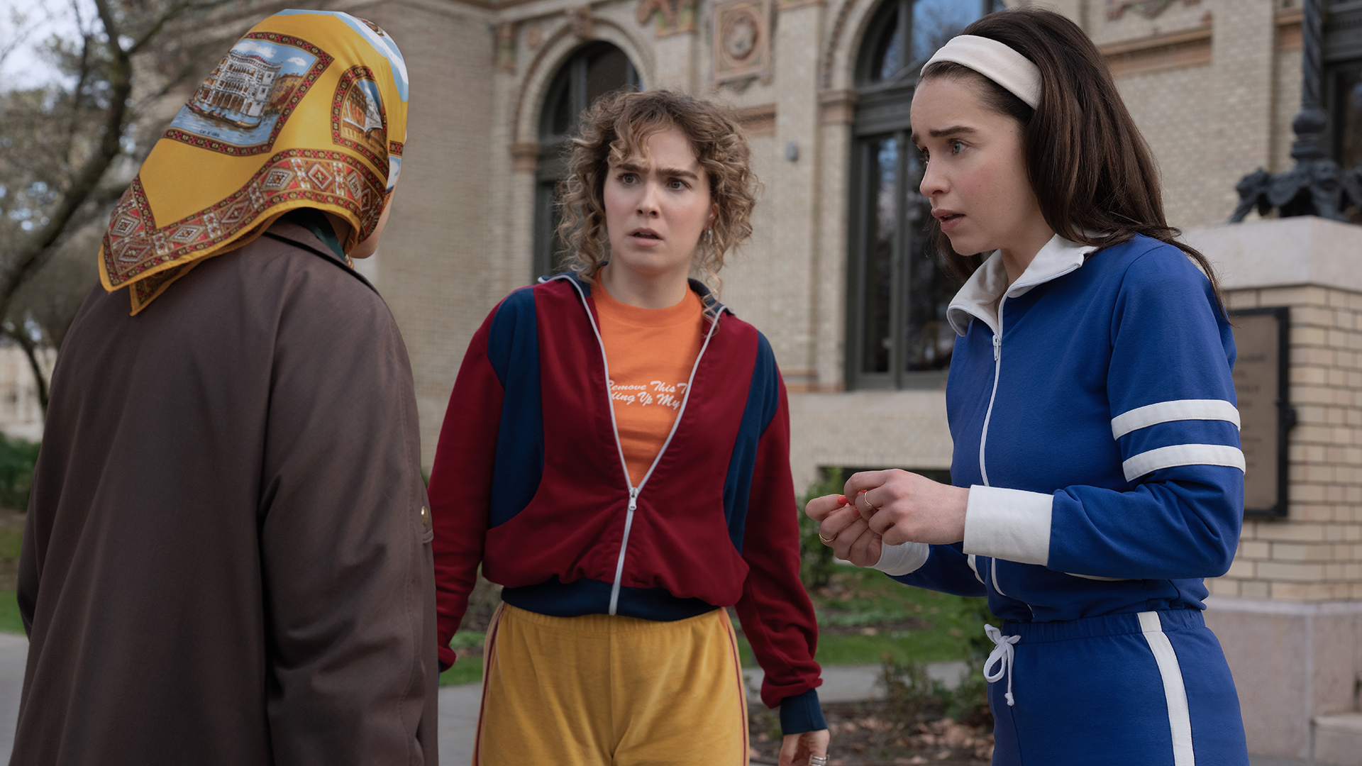 Twila and Bea looking shocked as they speak to a woman in Ponies