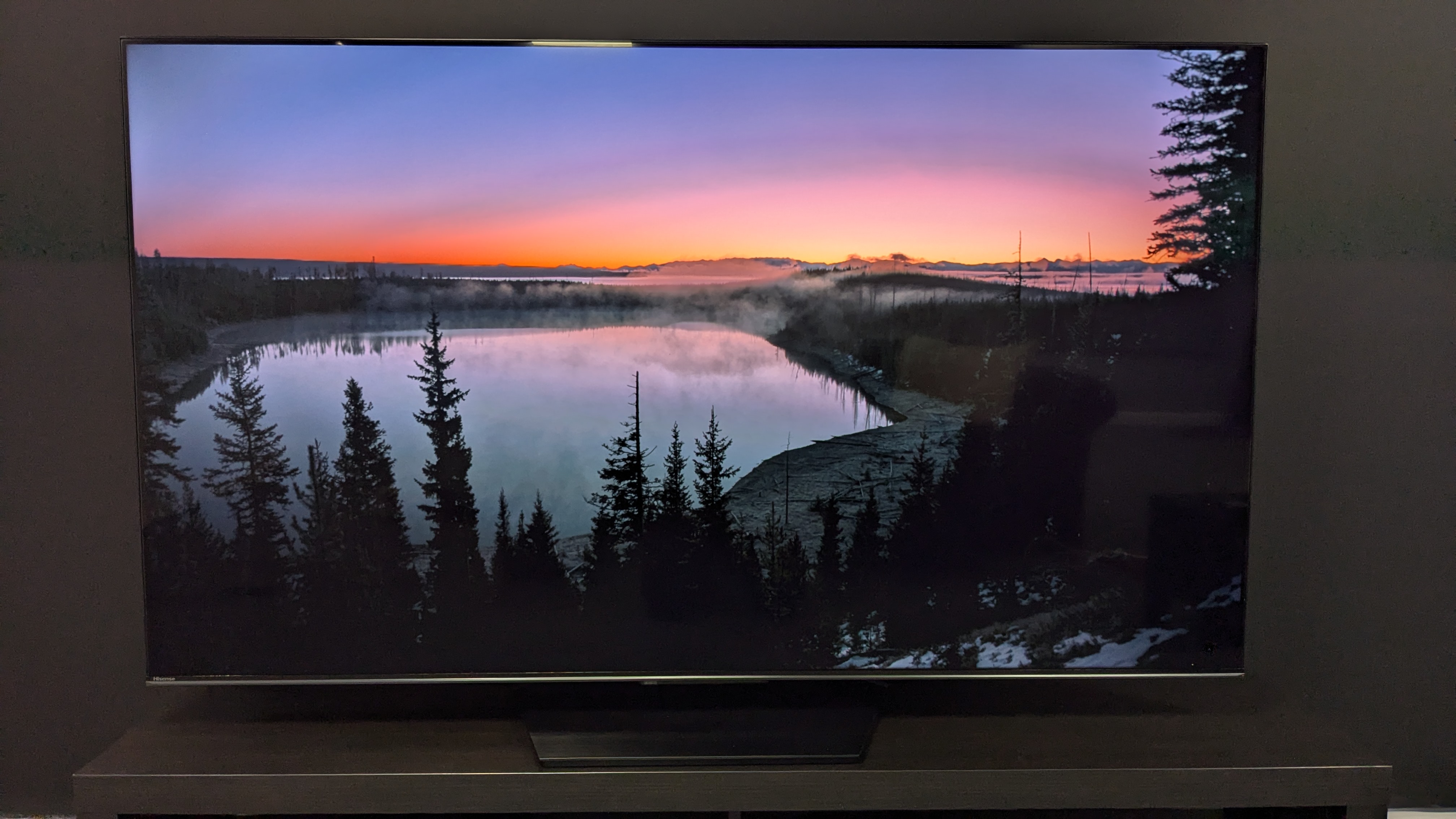 Hisense U7N with lake and sunset on screen 