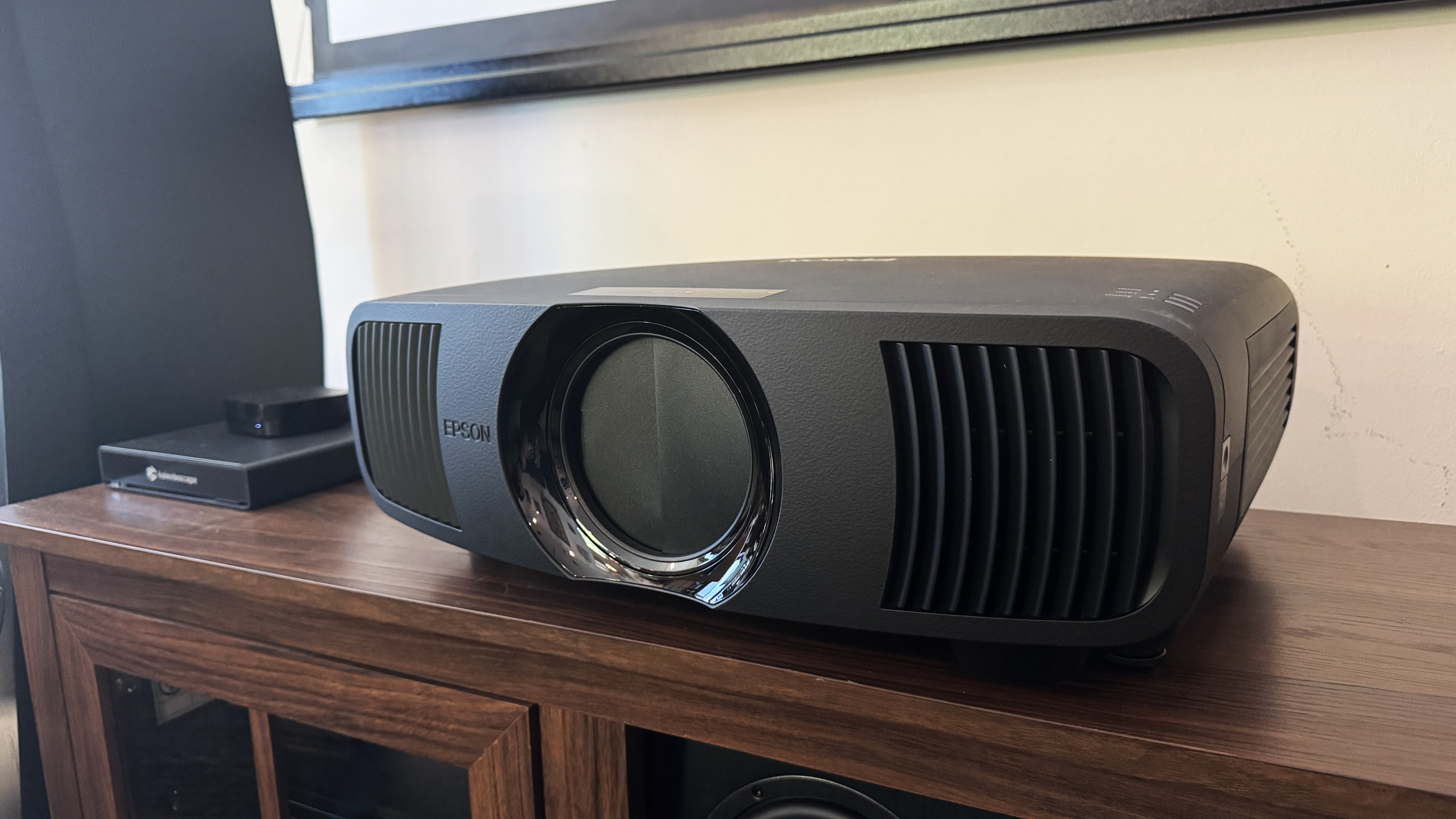 Epson Pro Cinema LS9000 on table at angle with lens cover closed