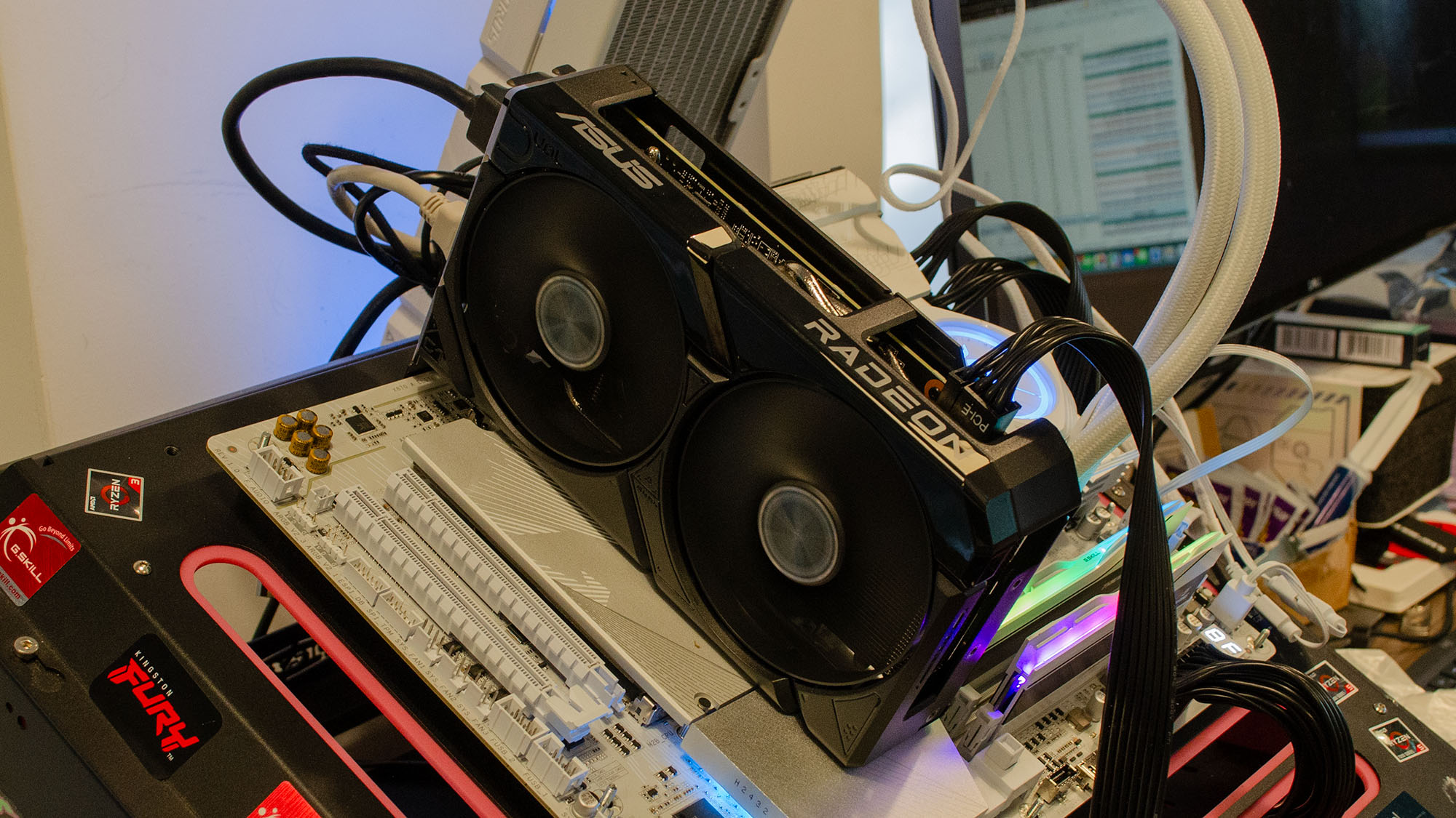 An AMD Radeon RX 9060 XT 8GB slotted into a testbench