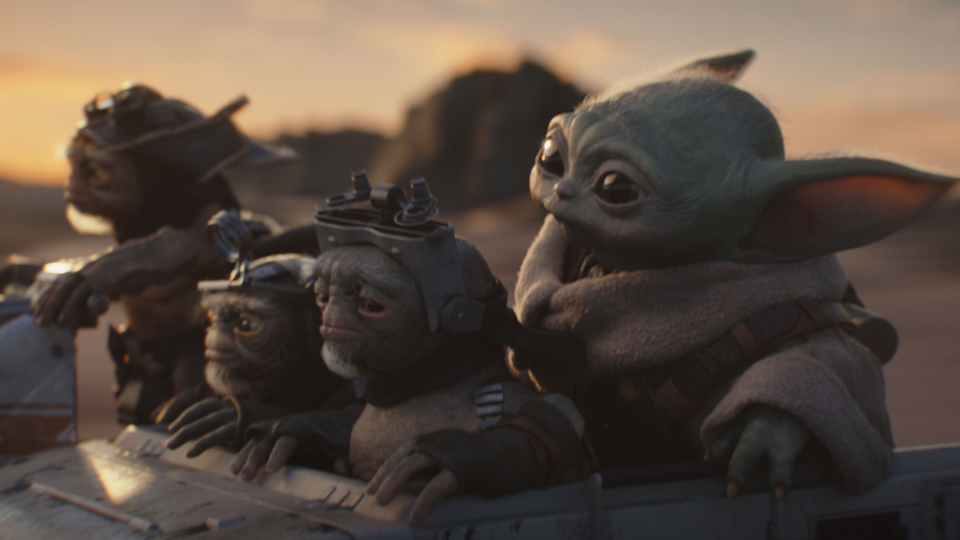 Bai, Clang, Keeto, and Baby Yoda riding in a vehicle in The Mandalorian and Grogu