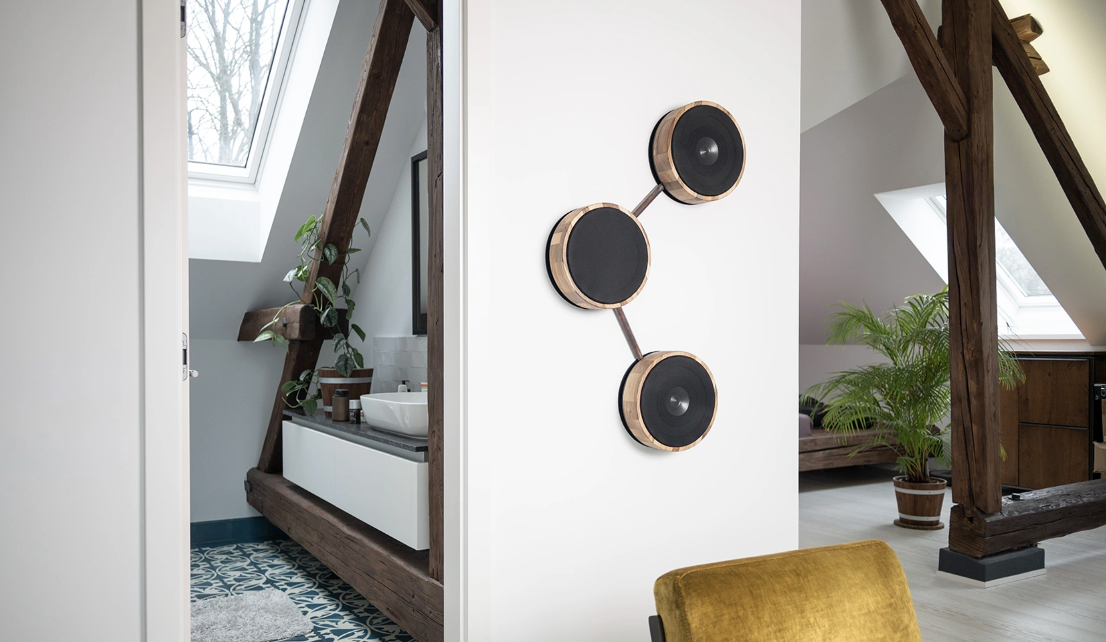 Ultrasonic Molecular Audio system on a white wall, showing multiple wall-mounted speakers connected to look like molecular structures