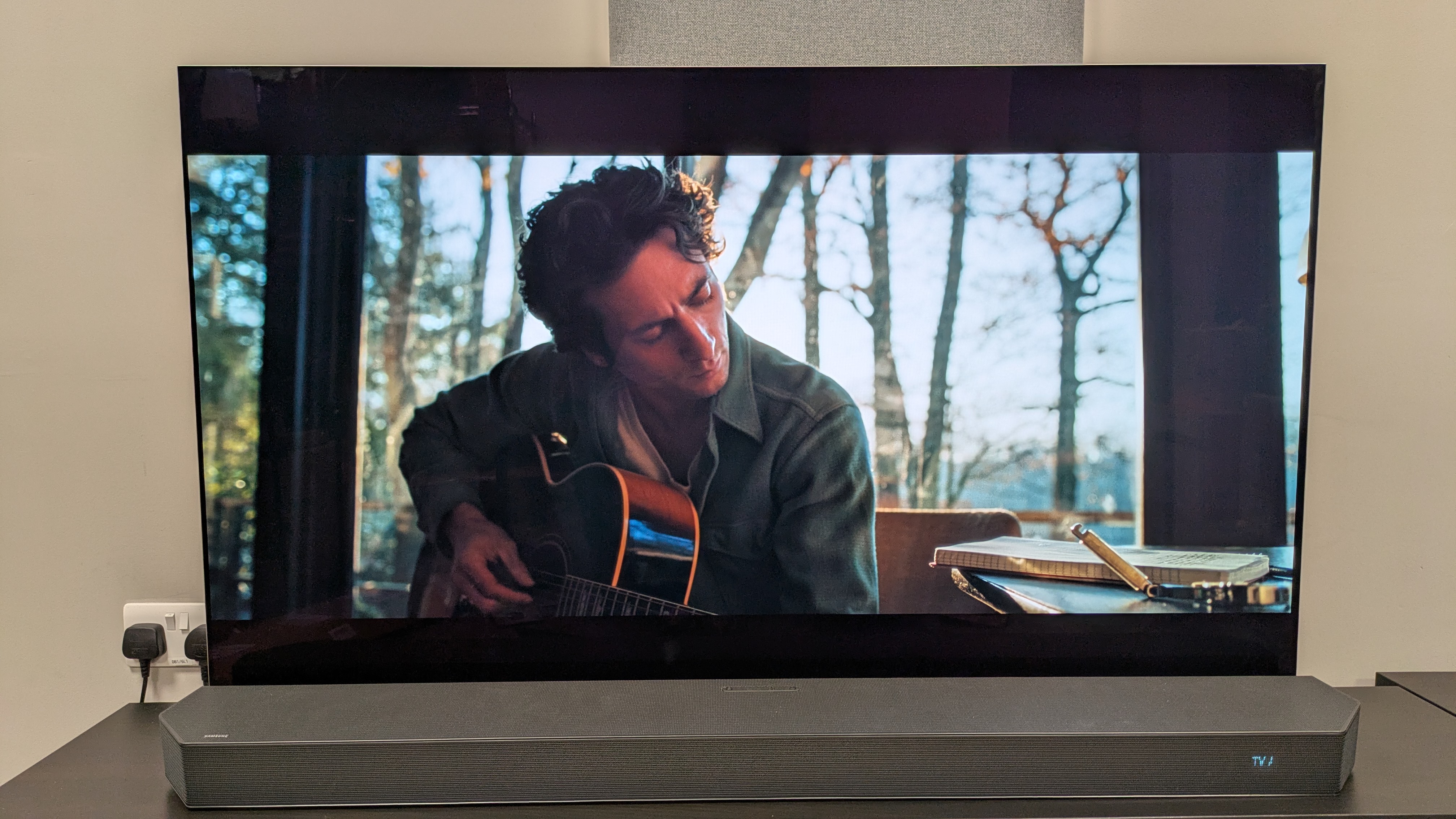 Springsteen: Deliver me from nowhere 4K Blu-ray on LG G5 showing Jeremy Allen White as Springsteen playing acoustic guitar