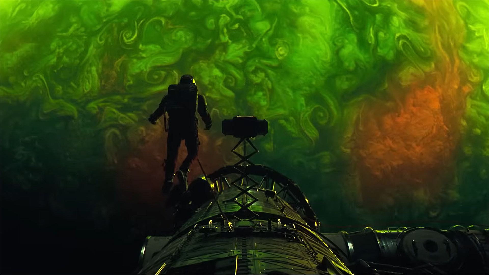 Ryland Grace looking at an alien planet while on a space walk in Project Hail Mary