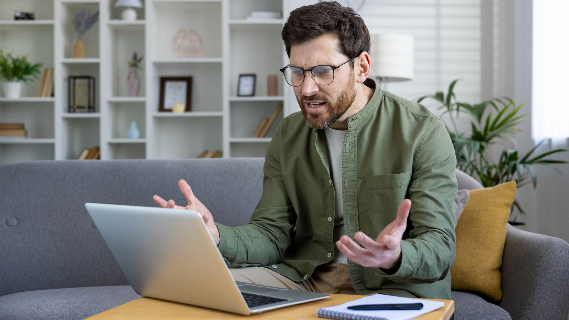 Annoyed Windows 11 user sat in front of their laptop