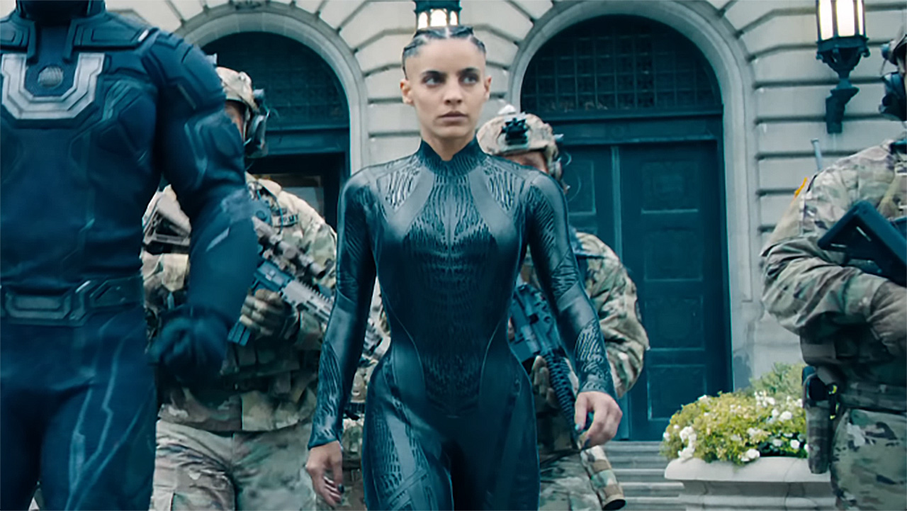 Angela Spica, aka The Engineer walking with some soldiers behind her in Superman