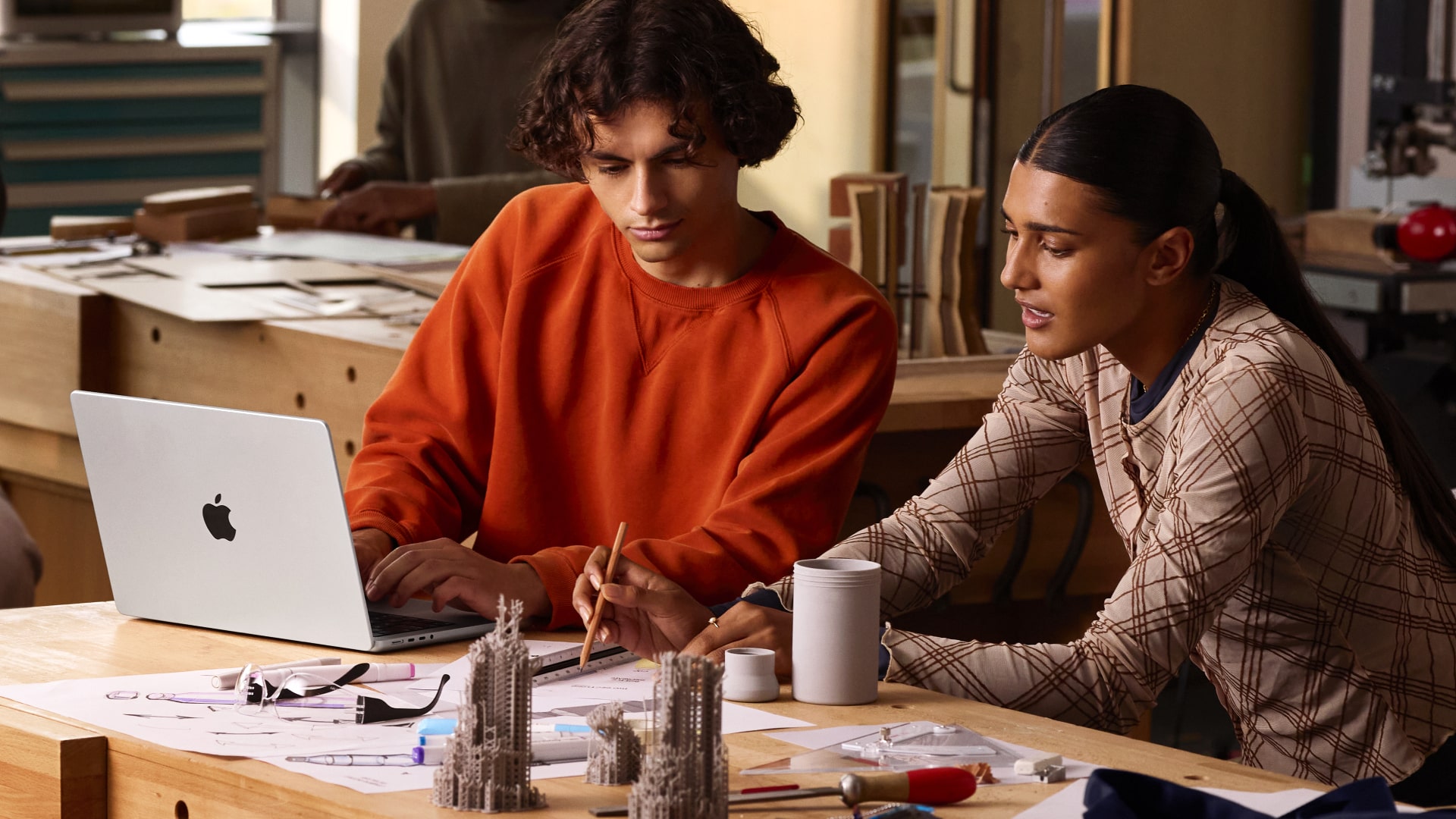 People using Apple's M5 MacBook Pro laptop.