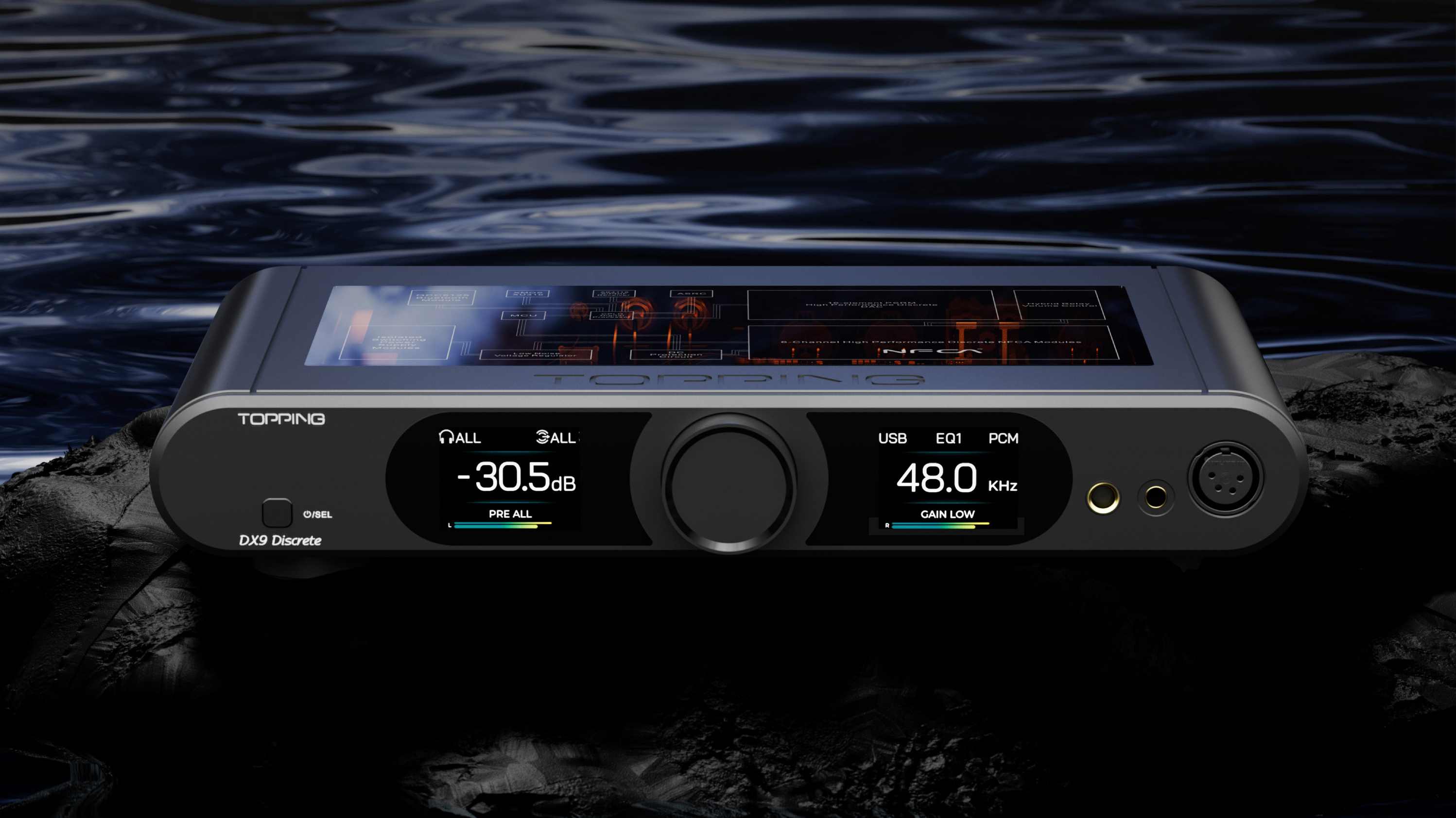 The Topping DX9 Discrete above a watery backdrop.