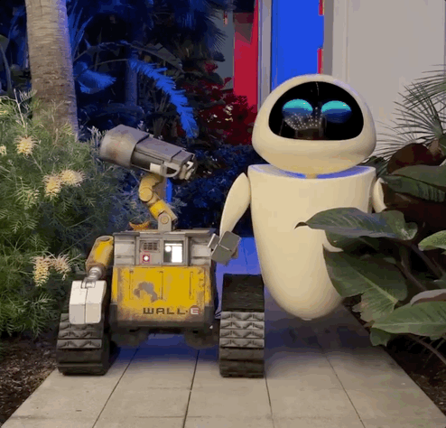 Wall-E and Eve robot characters roaming around the Pixar Place Hotel at the Disneyland Resort.