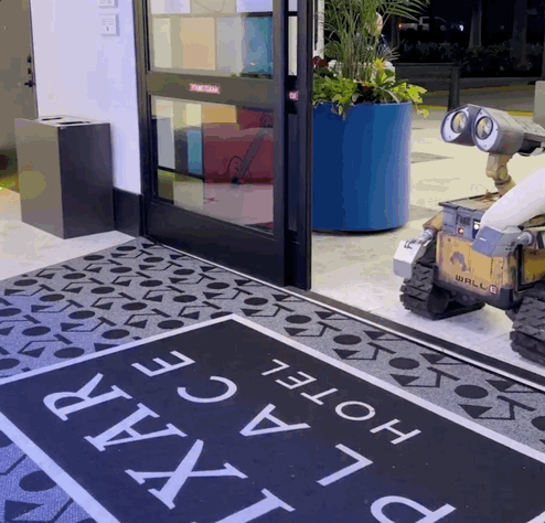 Wall-E and Eve robot characters roaming around the Pixar Place Hotel at the Disneyland Resort.