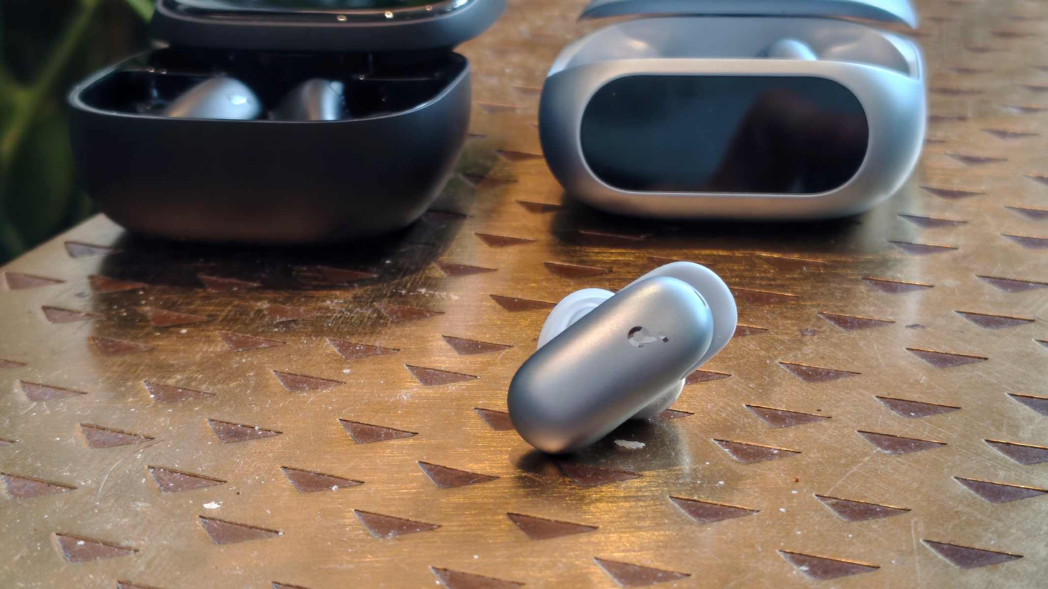 The Anker Soundcore Liberty 5 Pro earbud next to its case and the Anker Soundcore Liberty 5 Pro Max.
