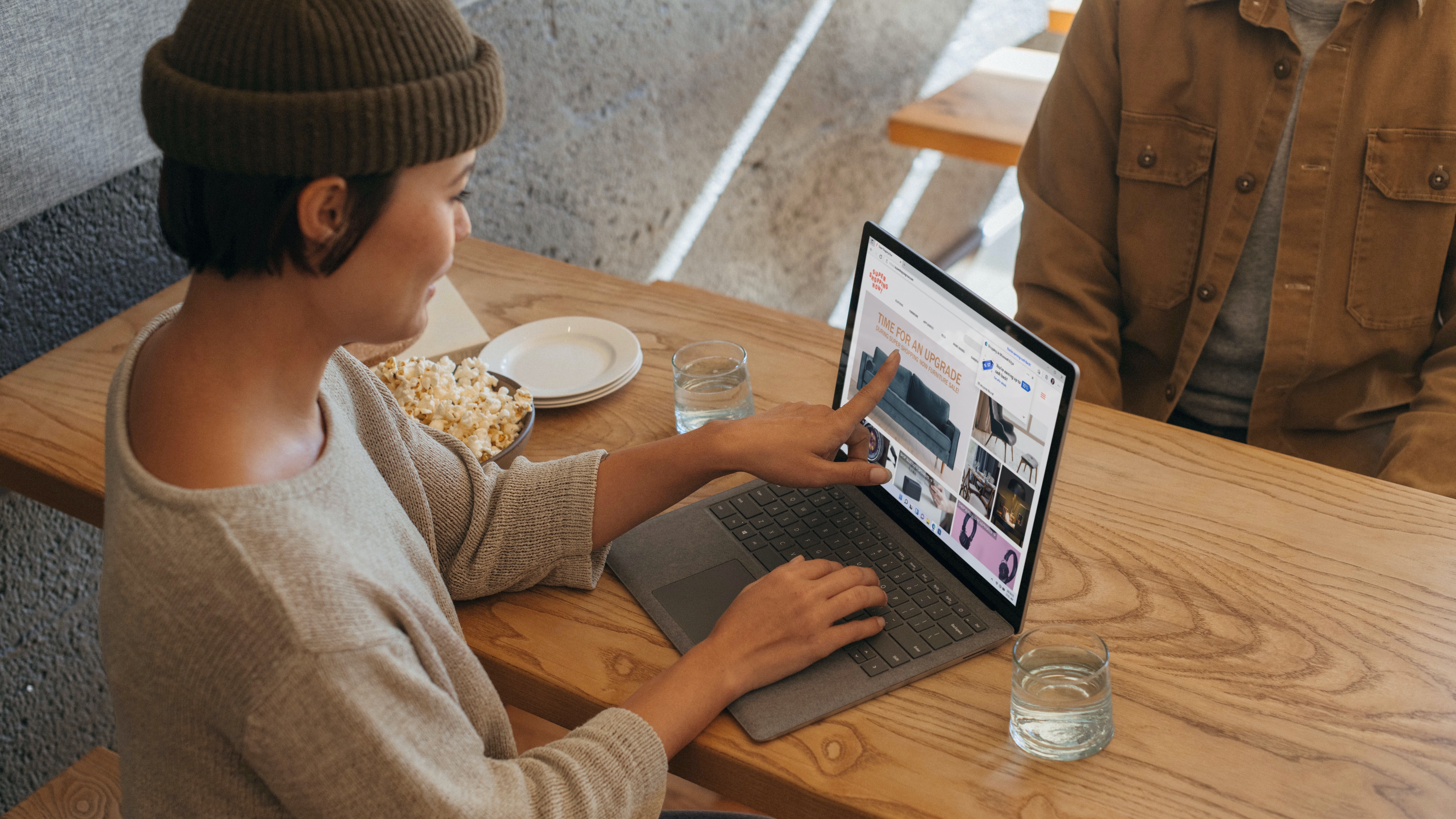 Woman using a Windows 11 computer with Microsoft Edge