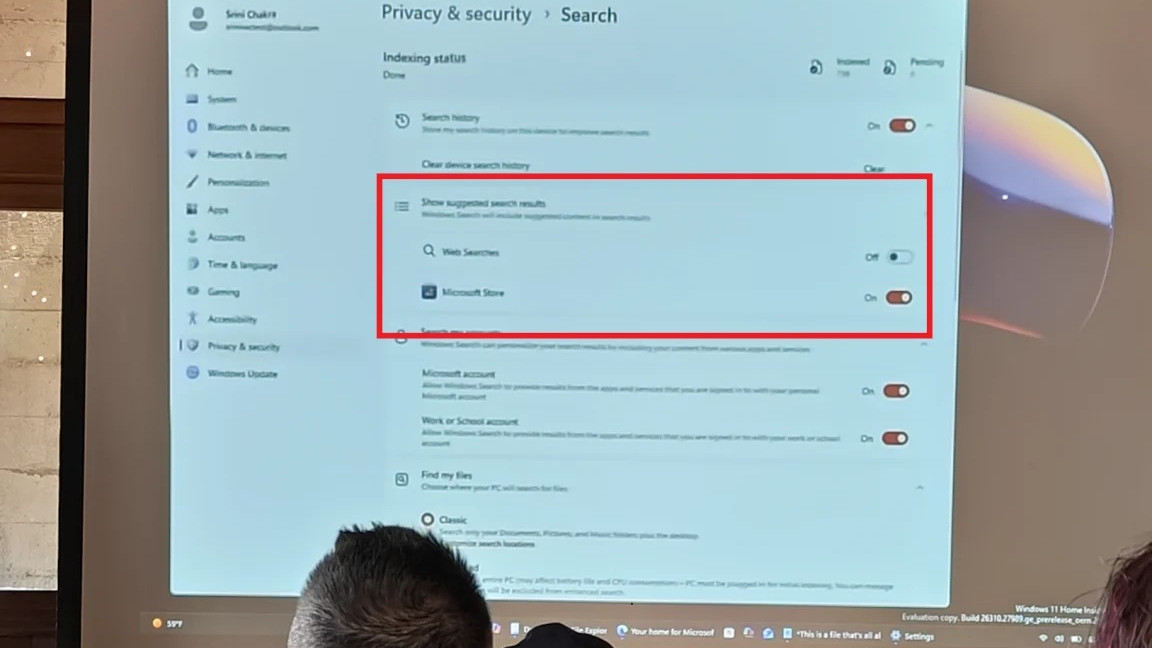 Windows 11 option to turn off web search results in Settings, shown at a meeting on a projector screen