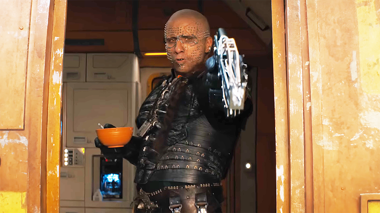 Krem firing a bolt from his crossbow while standing in a spaceship in Supergirl