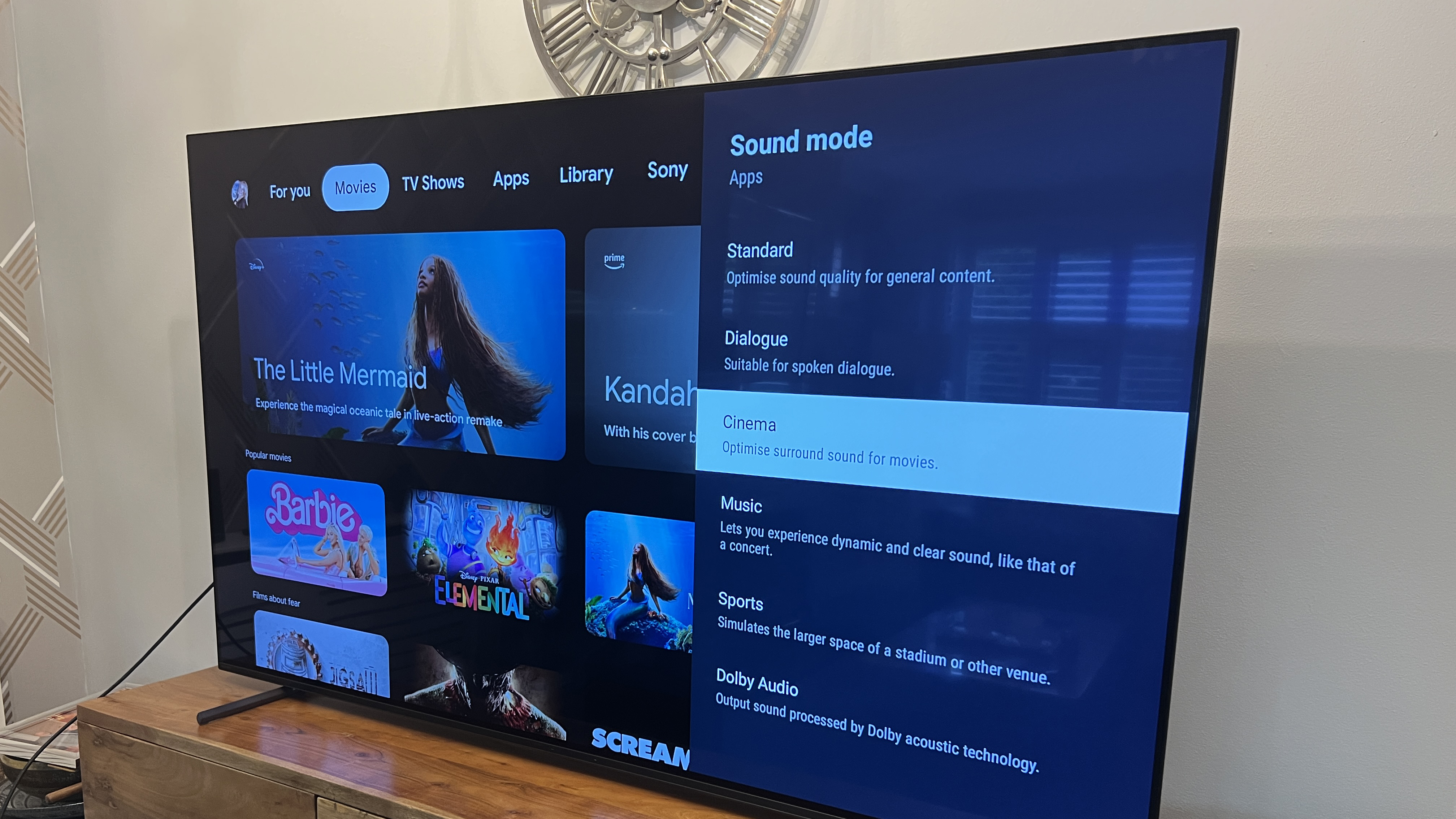A TV screen on a stand showing the sound settings