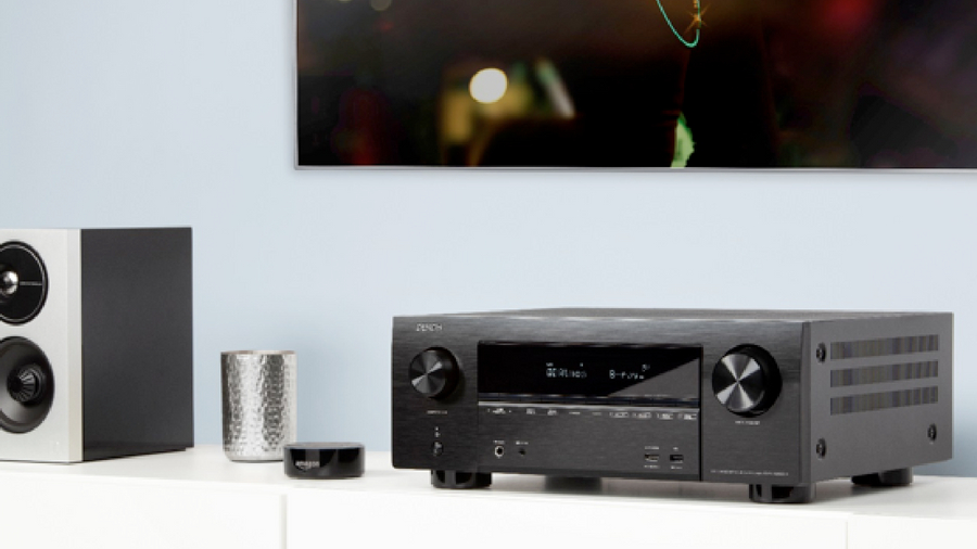 a denon avr beneath a tv