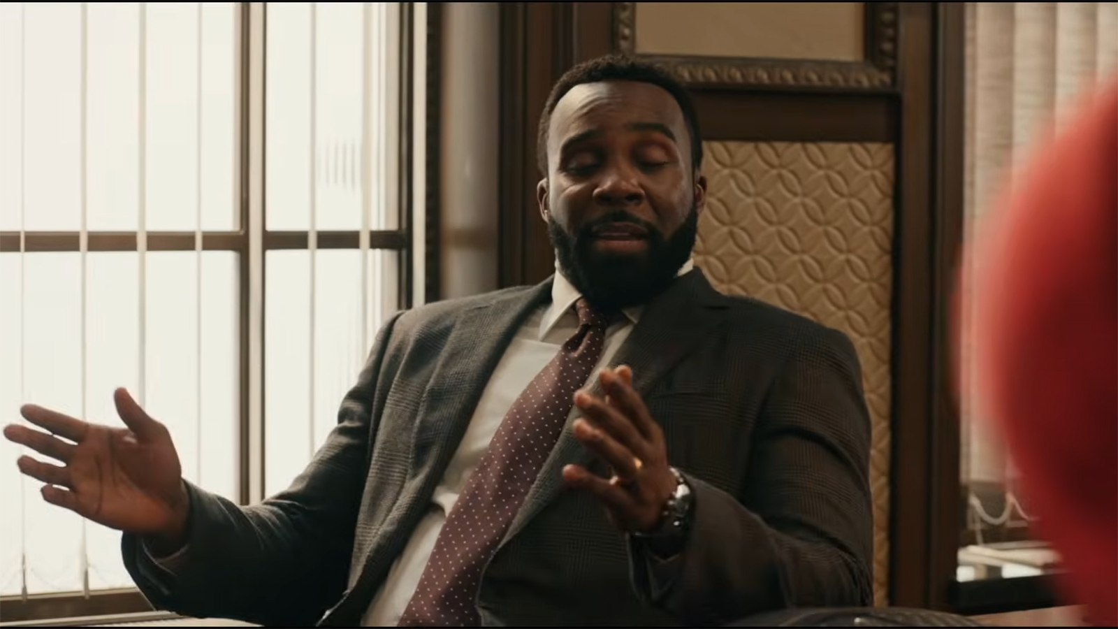 Tramell Tillman's character sitting in an office in Spider-Man: Brand New Day