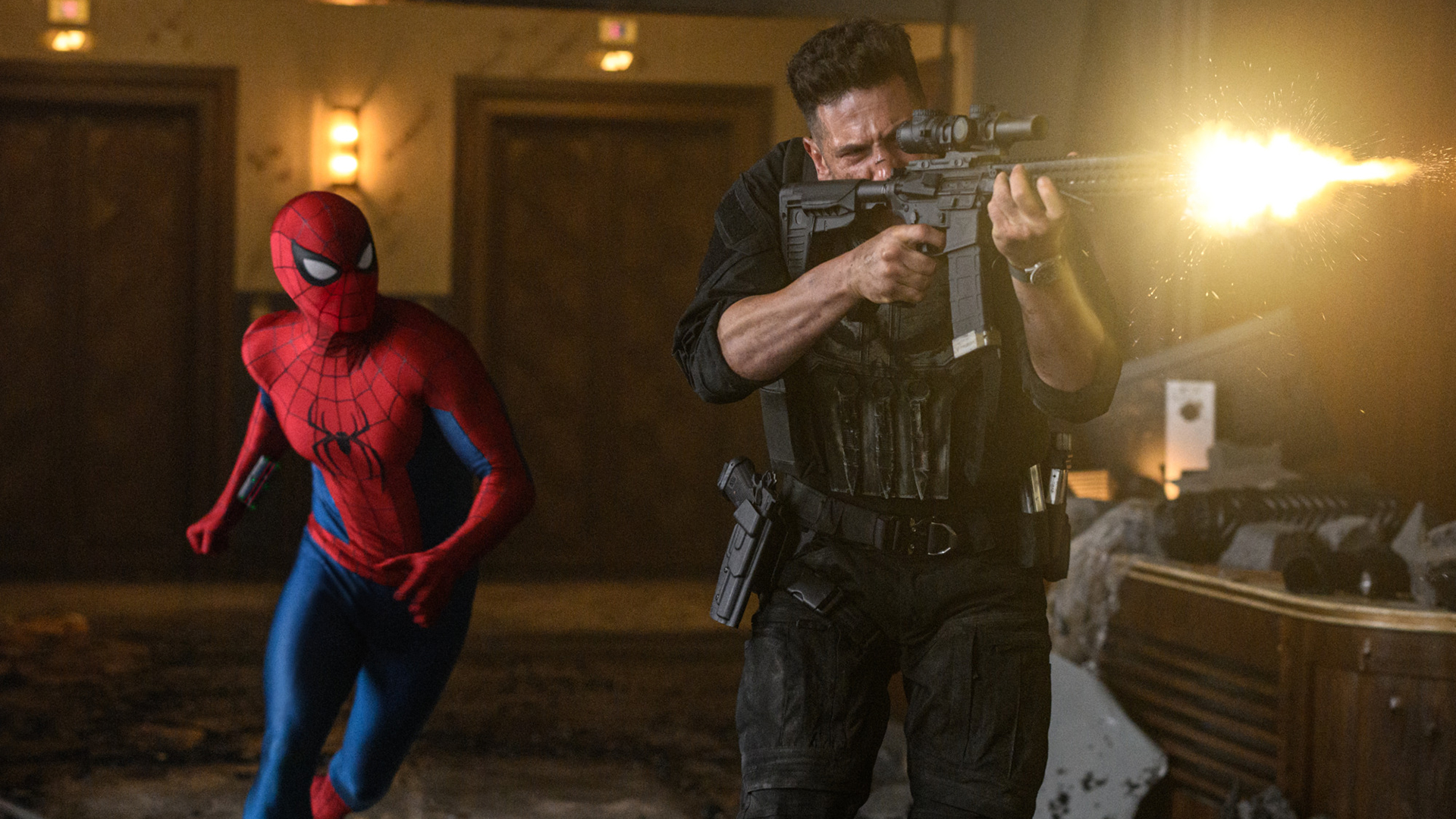 Spider-Man running behind Frank Castle/The Punisher, who's firing a gun, in Spider-Man: Brand New Day